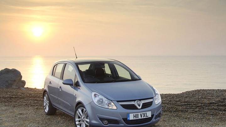 Vauxhall Corsa In Blue Near Sea At Sunset Time